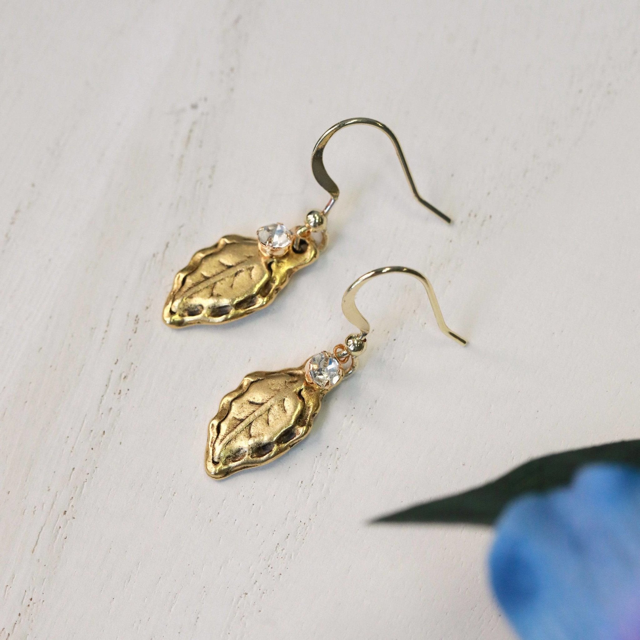 forest leaf charm earrings in gold with crystal charm side view