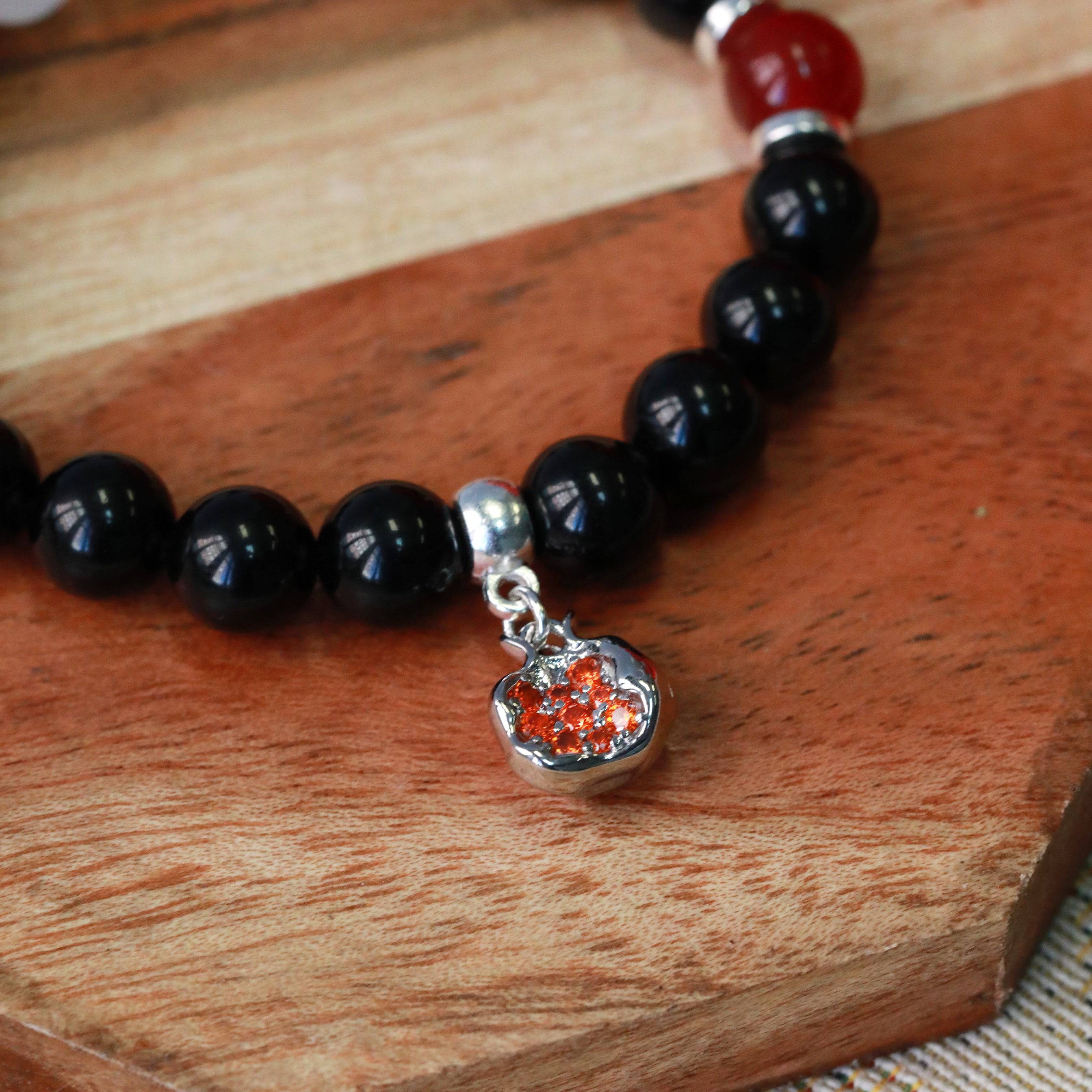 pomegranate gemstone stretchy charm bracelet in gold or silver inspired by Persephone and Hecate closeup hecate