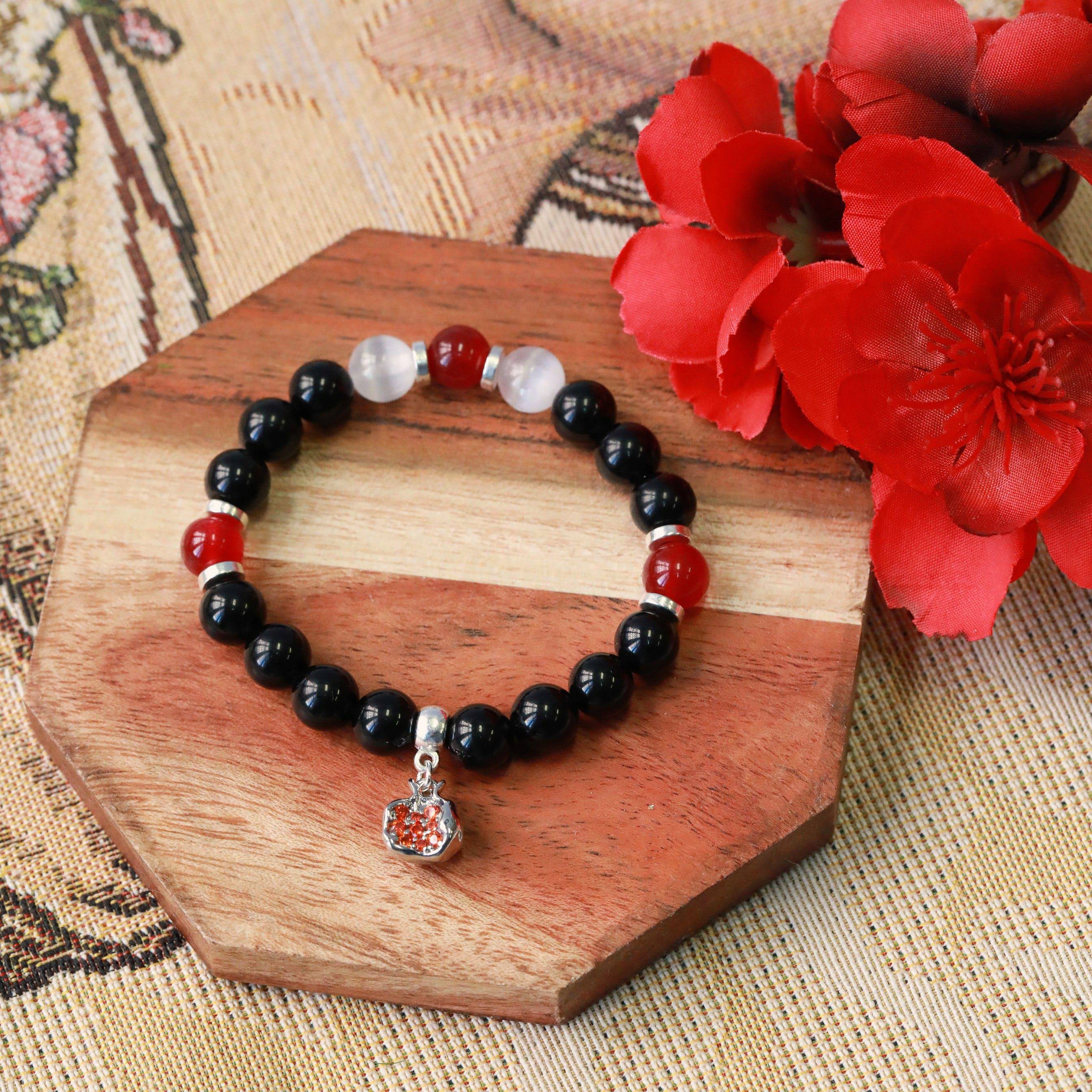 pomegranate gemstone stretchy charm bracelet in gold or silver inspired by Persephone and Hecate top view hecate