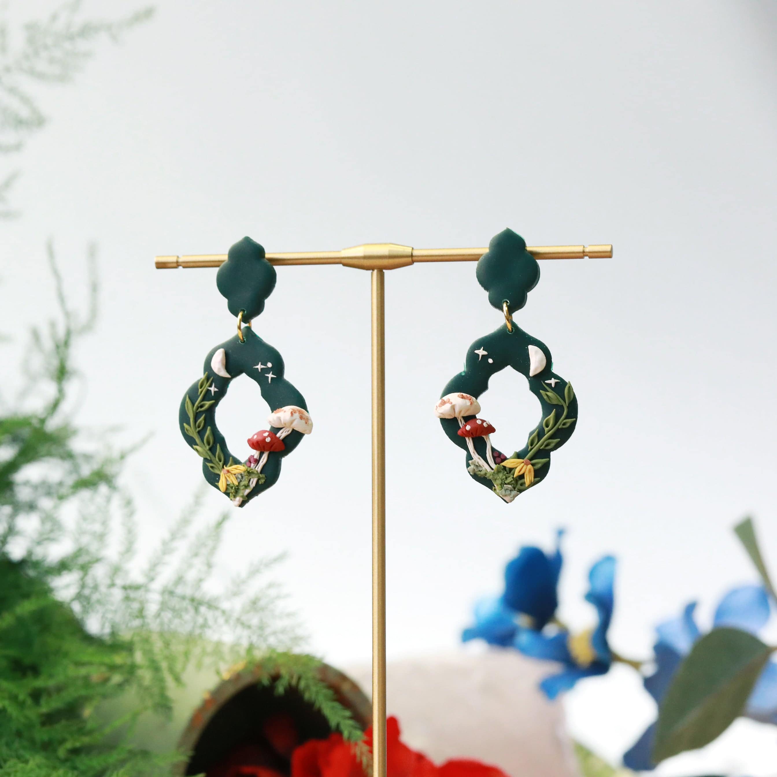 cottagecore scene forest green clay earrings by Everything Ky yand I holder picture