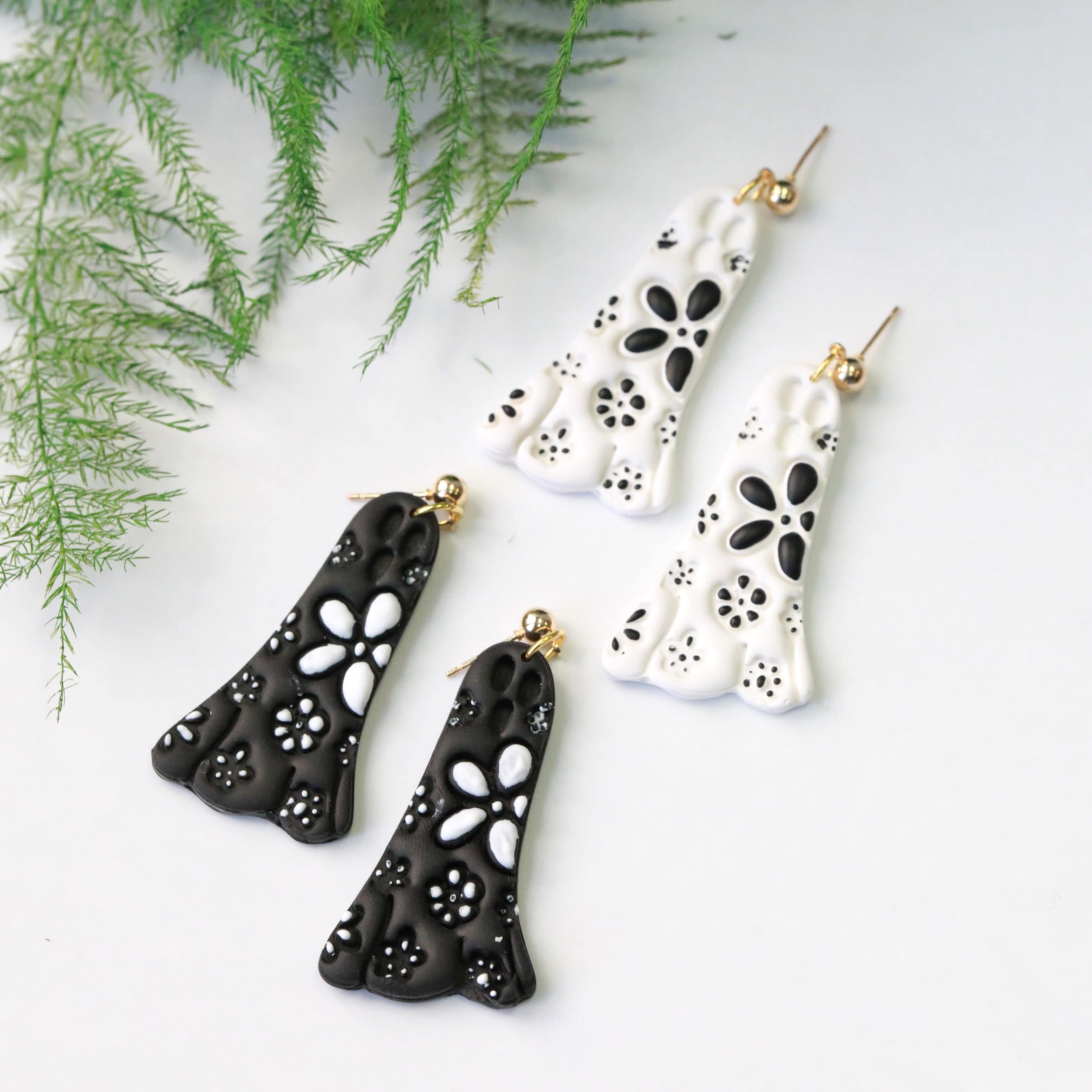 daisy ghost clay earrings in black and white by everything ky and i pair image top 