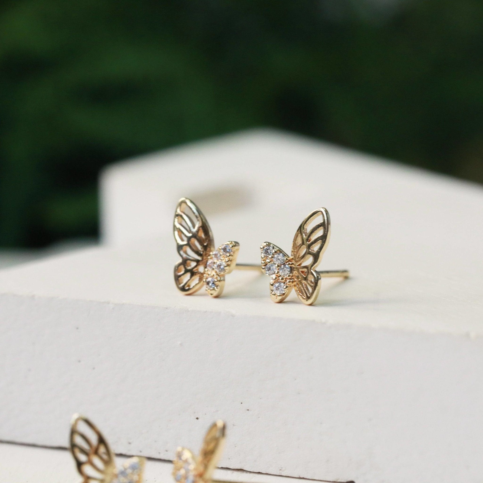 dainty butterfly crystal studs closeup