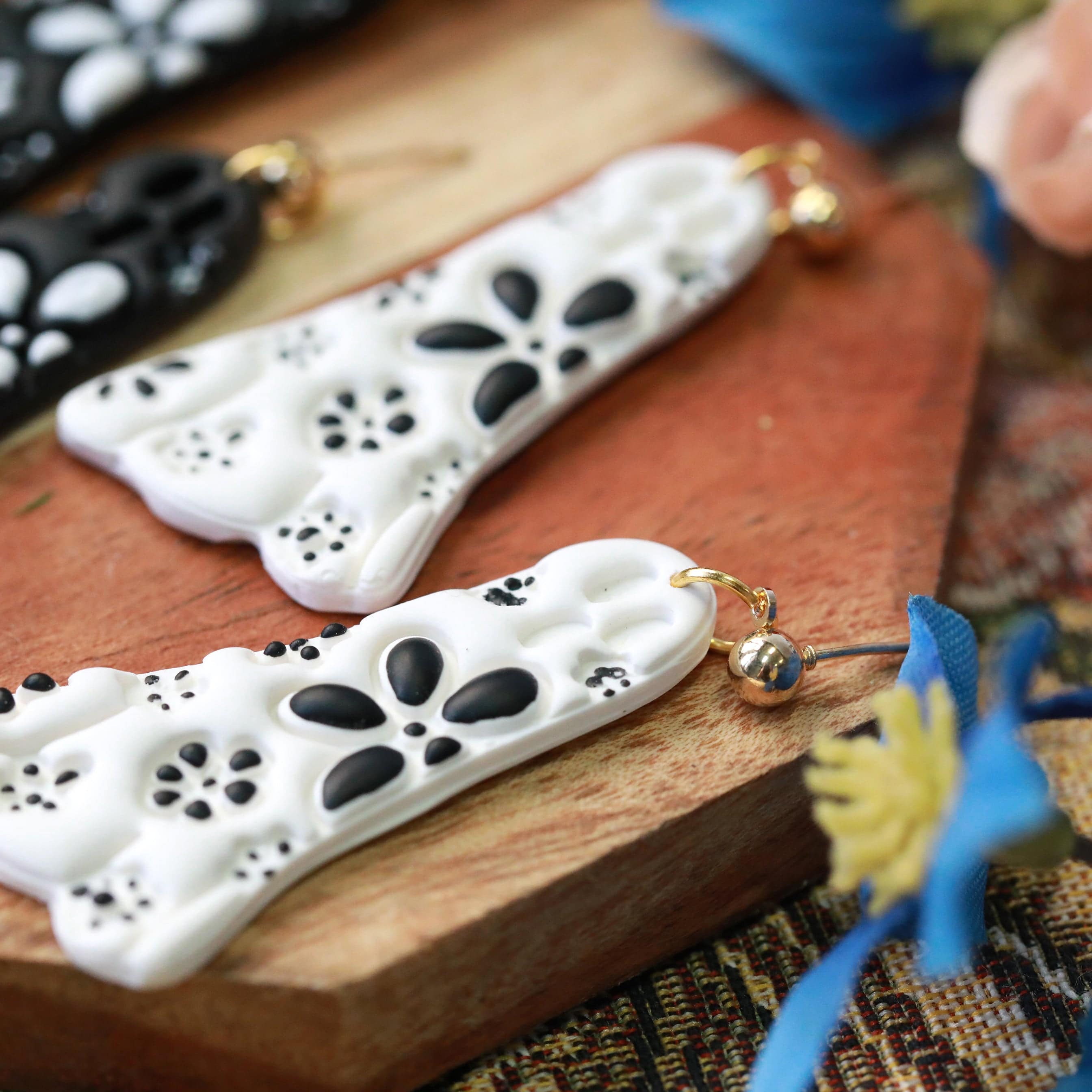 daisy ghost clay earrings in black and white by everything ky and i white closeup