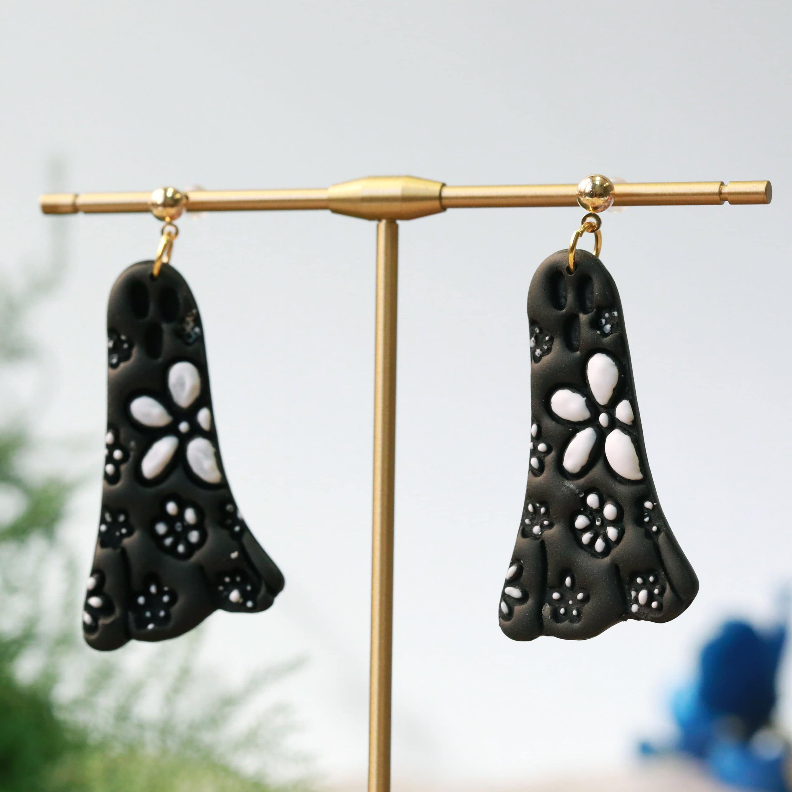 daisy ghost clay earrings in black and white by everything ky and i hanging image